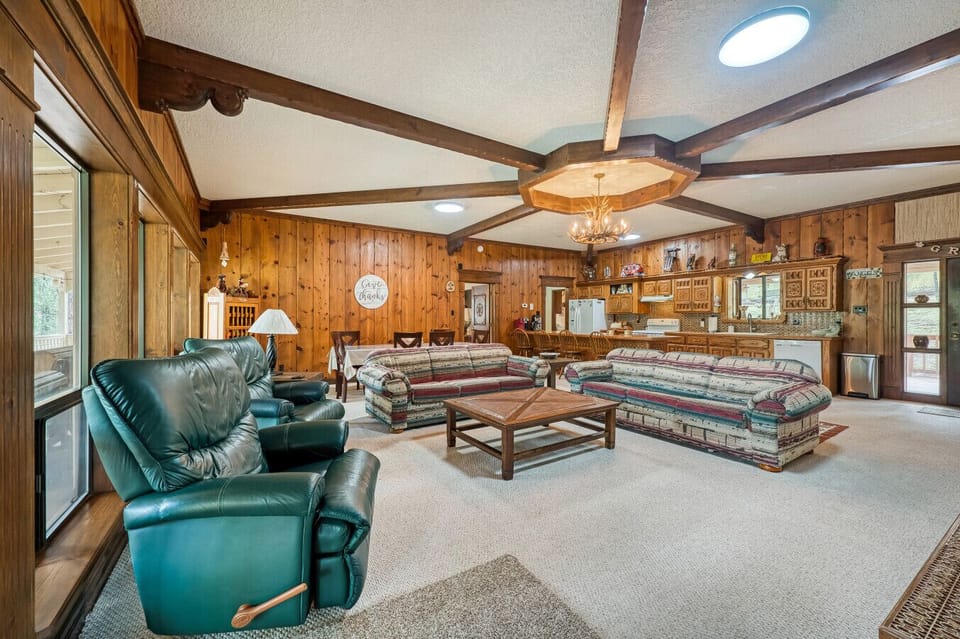 Living Room | Fireplace, Antler Chandelier & Rustic Cabin Décor