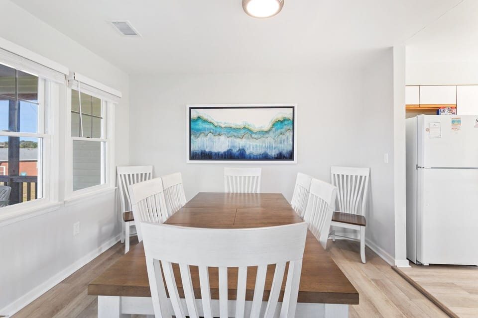 Dining Area — Dining table designed for shared meals, family game nights, or board games, with flexibility to double as a remote work space.