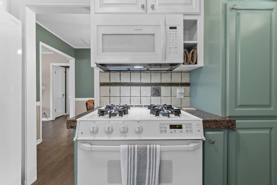 Gas stove is perfect for dinner inside. Microwave above stove for quick cooking
