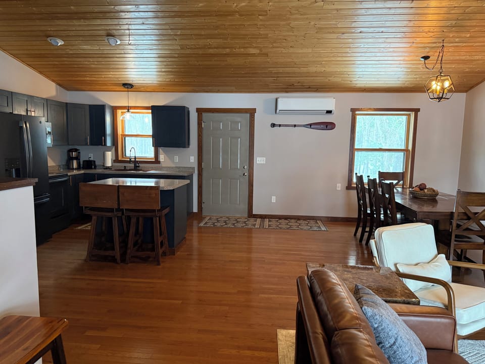 Upstairs main living space with front entry door.