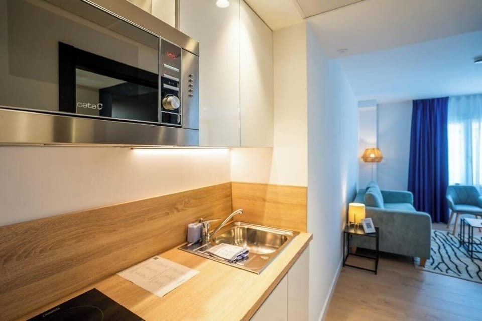 Prepare easy breakfasts in the sleek kitchenette with modern appliances.
