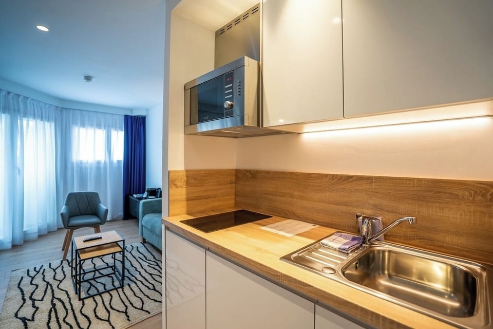 Start slow mornings with an easy kitchenette and warm lighting.