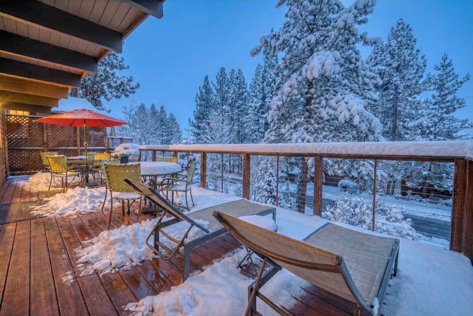 Deck: Upper floor, two outdoor dining sets with umbrellas, sun loungers, seating for 8, access from dining area