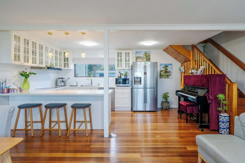 Bright and spacious living room with piano 