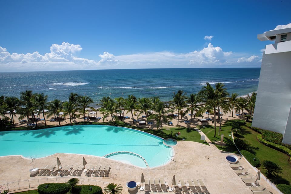 Steps from the beach with direct ocean and pool views from your balcony.