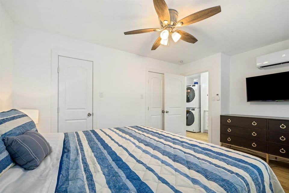 Smart TV and dresser included.