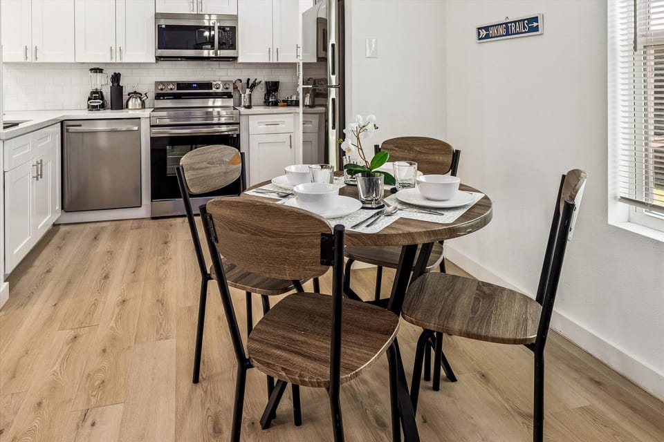 Charming dining table that sits 4 with full tableware and silverware included.