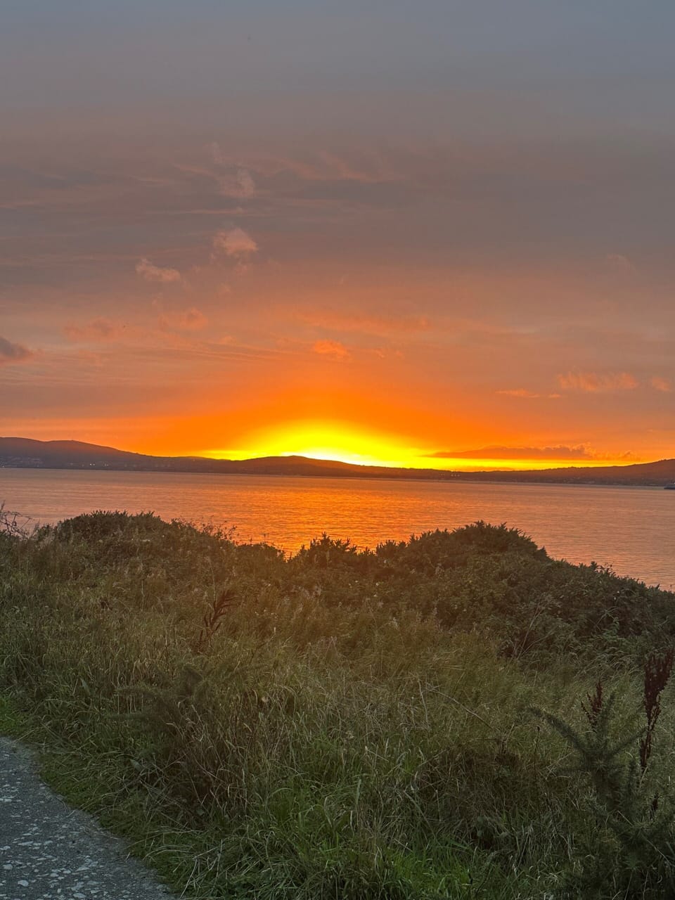 sunset over Helen's Bay coast
