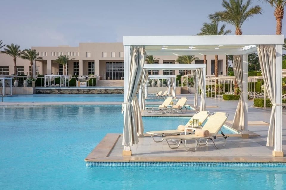 Lounge in your shaded cabana with cocktails within reach.