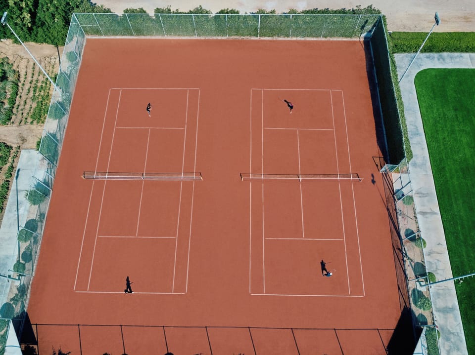 Serve, rally, and compete on pristine private tennis courts.