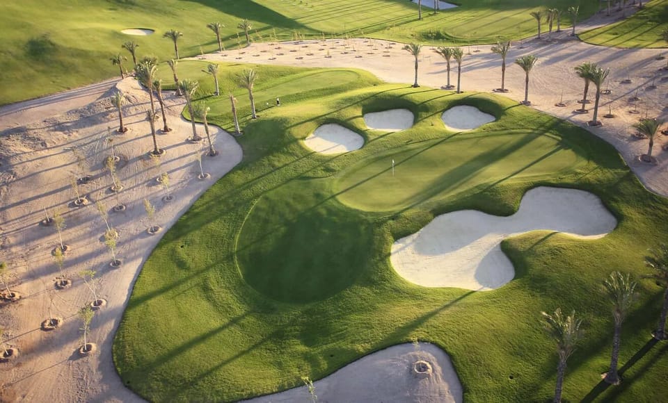 Tee off nearby on lush fairways under wide-open skies.