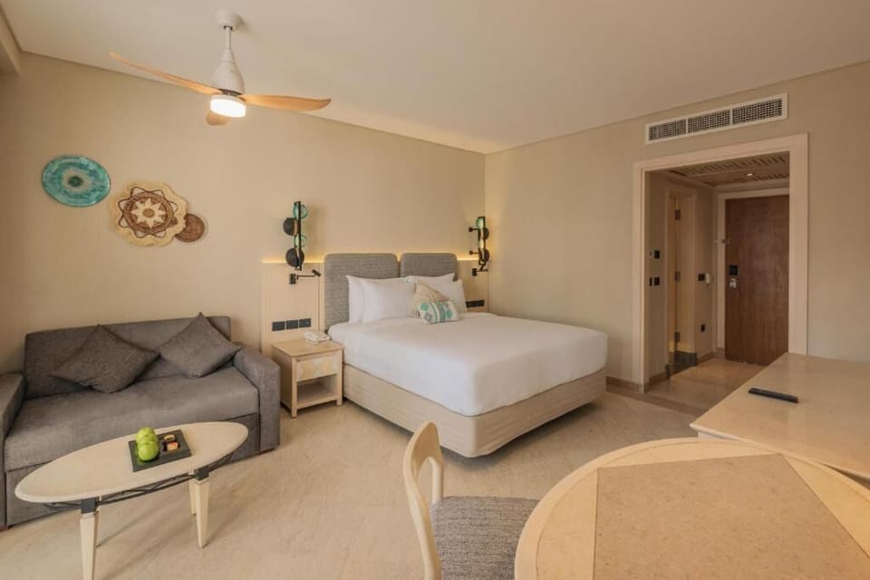 Unwind on the plush sofa beside crisp, cloudlike linens.