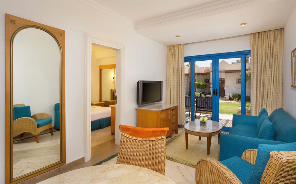 Unwind on the cozy sofa with sunshine and garden views.