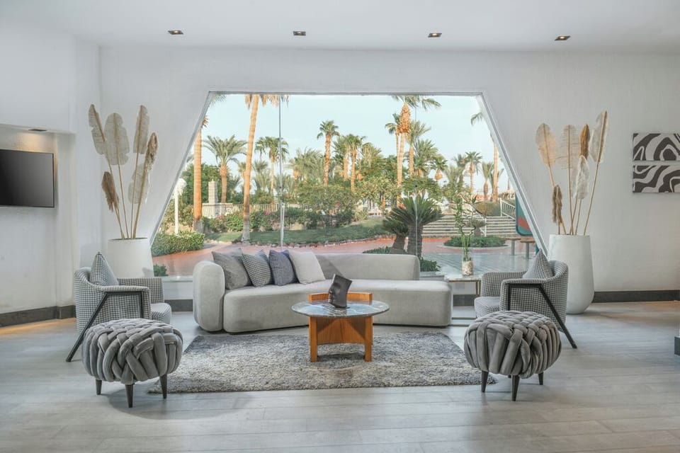 Unwind in a sunlit lounge with serene garden views.