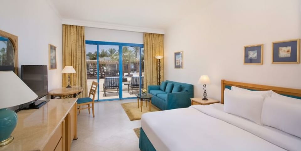 Relax on the sofa after beach days in this calm king room.