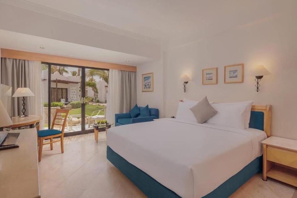 Stretch out in a serene king bed with garden views.
