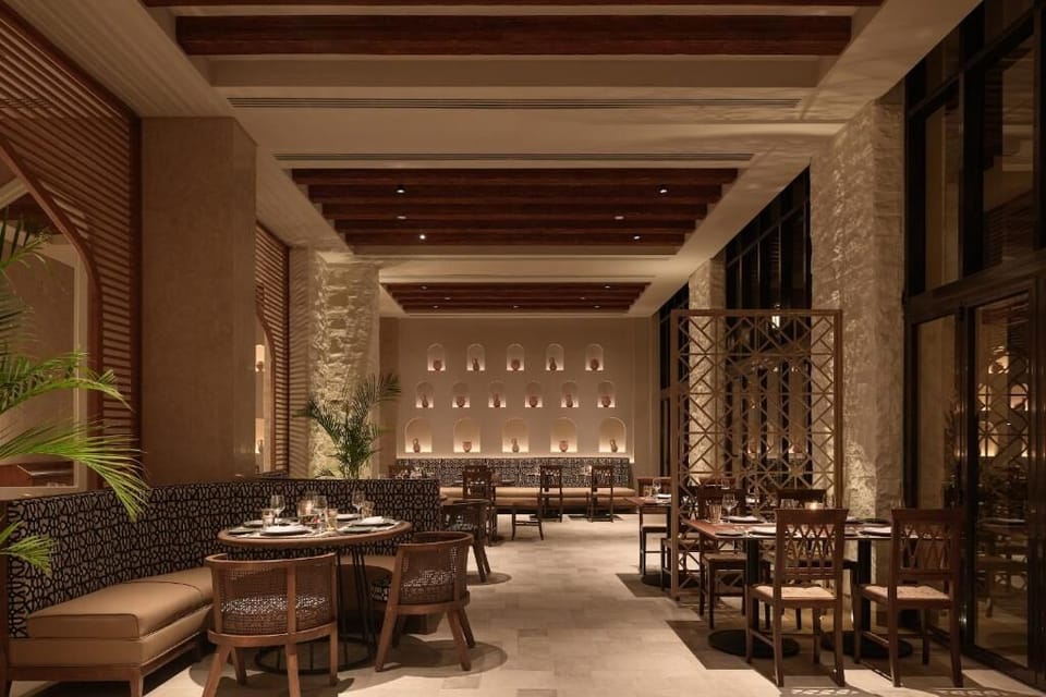 Dine under warm lantern light in a refined, cozy setting.