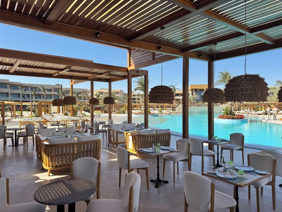 Dive into sunlit days with poolside dining and resort vibes.