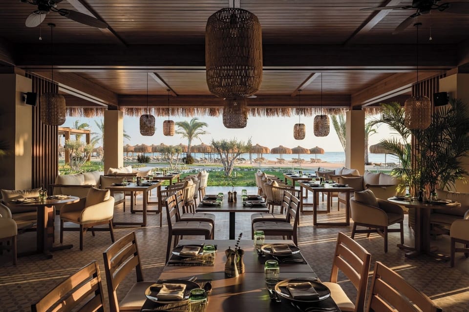 Savor sunset dinners with ocean breezes and warm lighting.