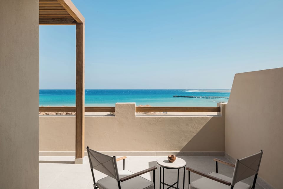 Sip sunset drinks while gazing over turquoise water.