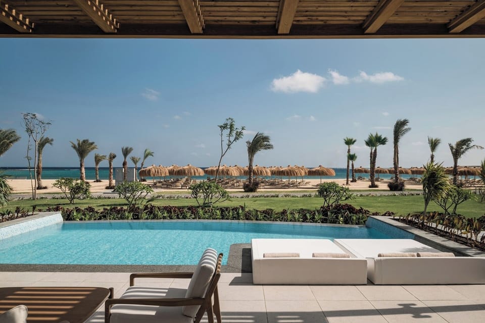 Soak up sunshine beside the pool, steps from the beach.