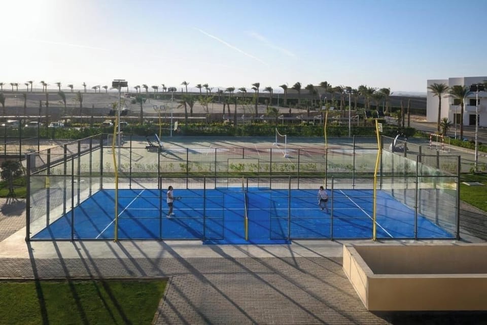 Challenge friends to a sunny match on pristine courts.