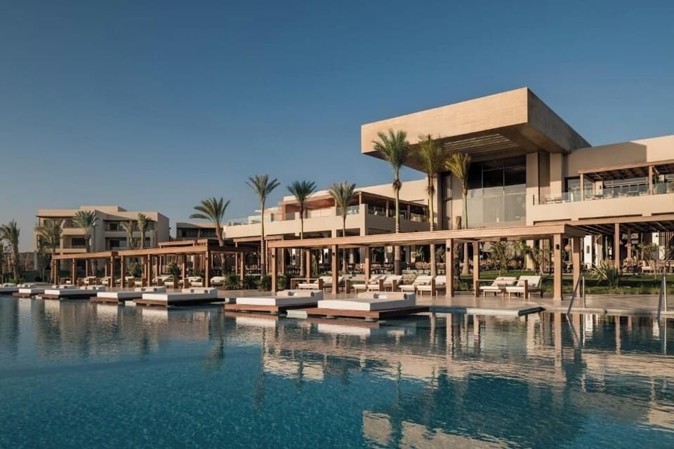 Stretch out on stylish daybeds with chic poolside service.