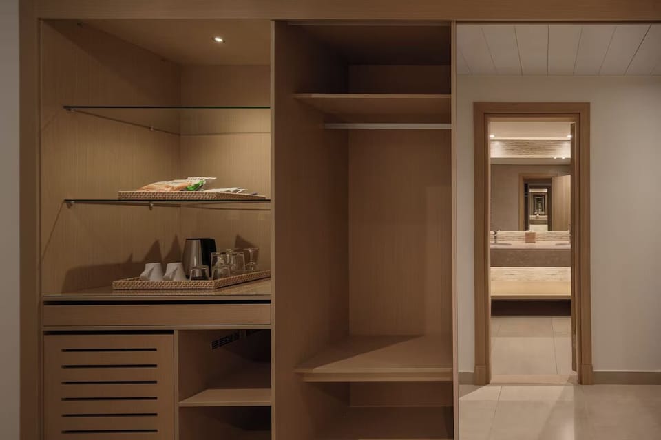 Refresh with in-room coffee, tea, and convenient storage space.