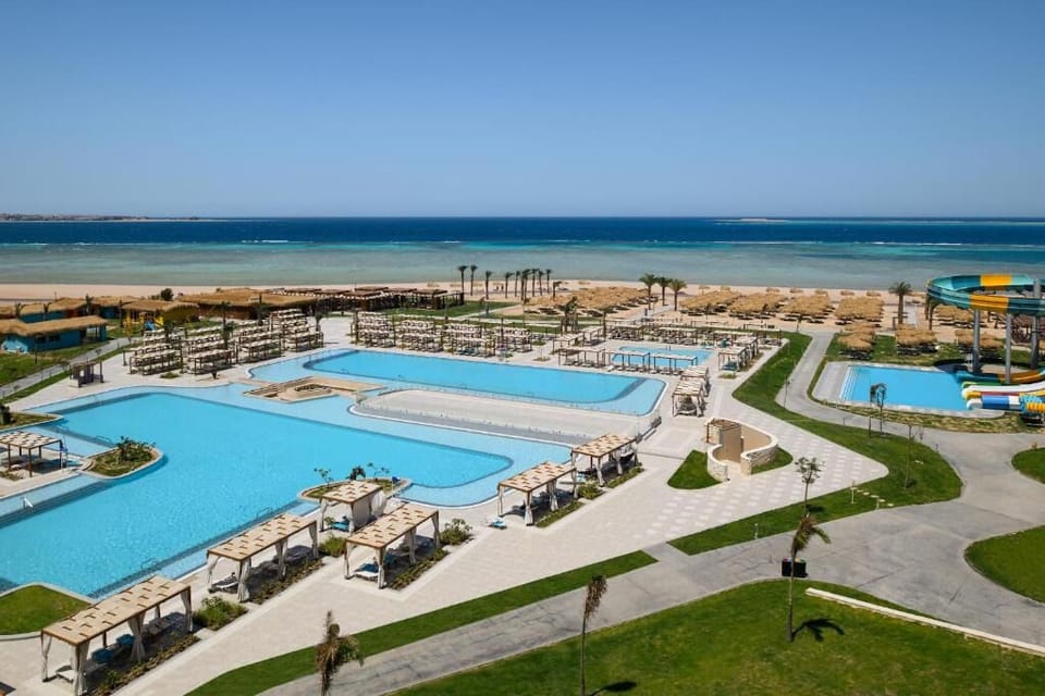 Dive into shimmering beachfront pools with endless sea views.