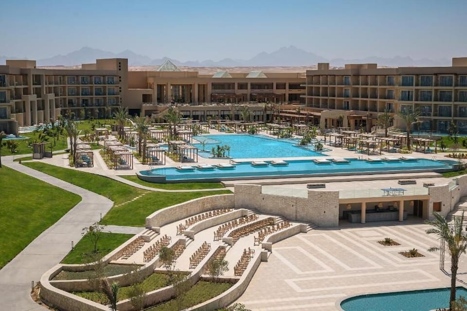 Picture arriving to a grand resort oasis with endless space.