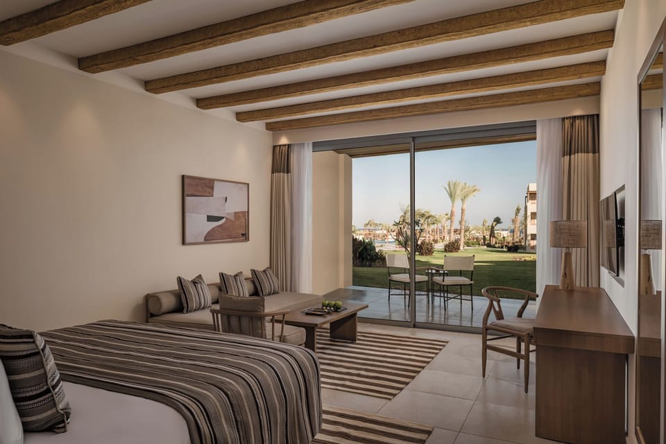 Stretch out in comfort with calm resort views outside.