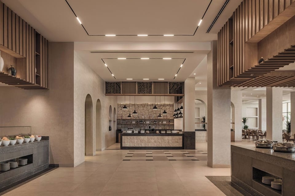 Stroll into spacious dining with modern lines and calm tones.