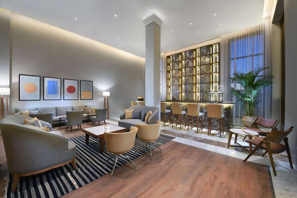 Unwind in the stylish lounge with warm evening ambiance.