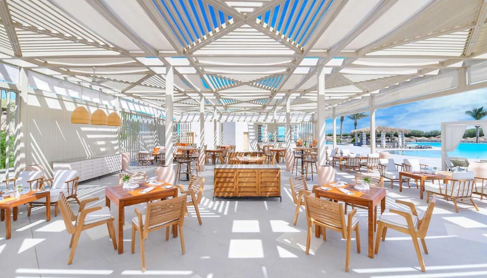Savor sunny poolside lunches under breezy, shaded pergolas.