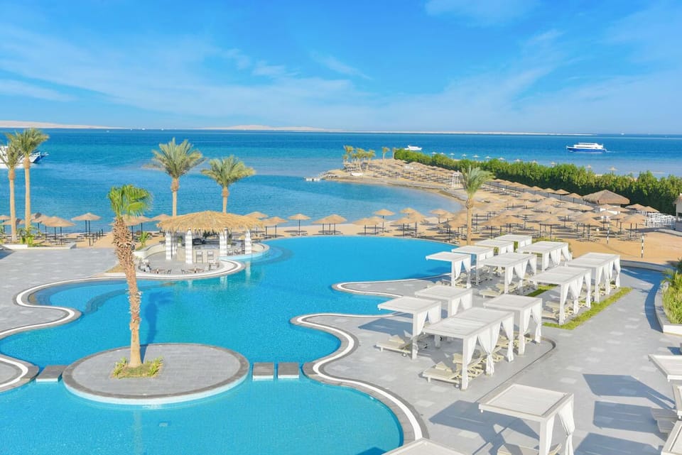 Soak in panoramic sea views from the signature lagoon pool.