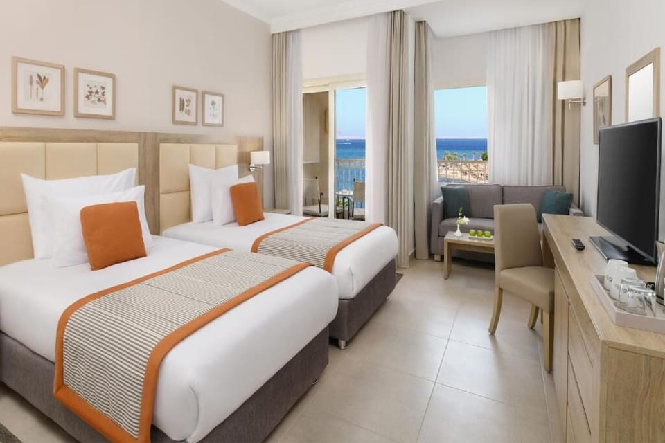 Start the day with ocean breezes from bright twin beds.