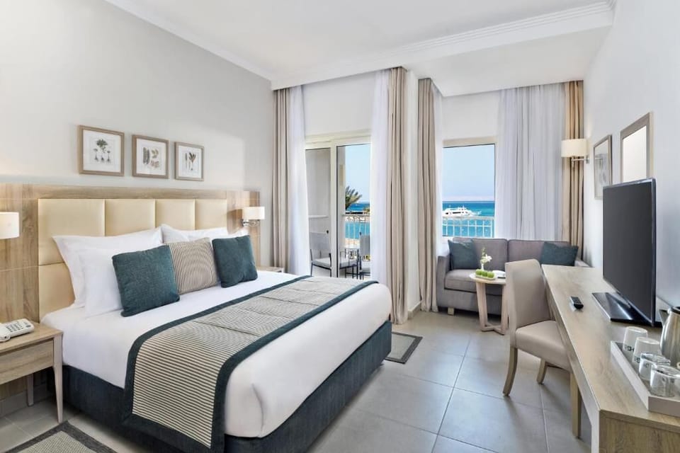 Wake to shimmering sea views from a plush king bed.