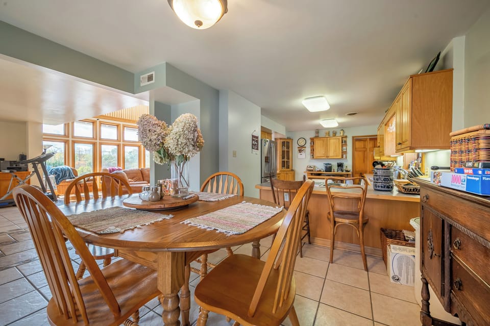 Dining area open to kitchen, ready for family meals