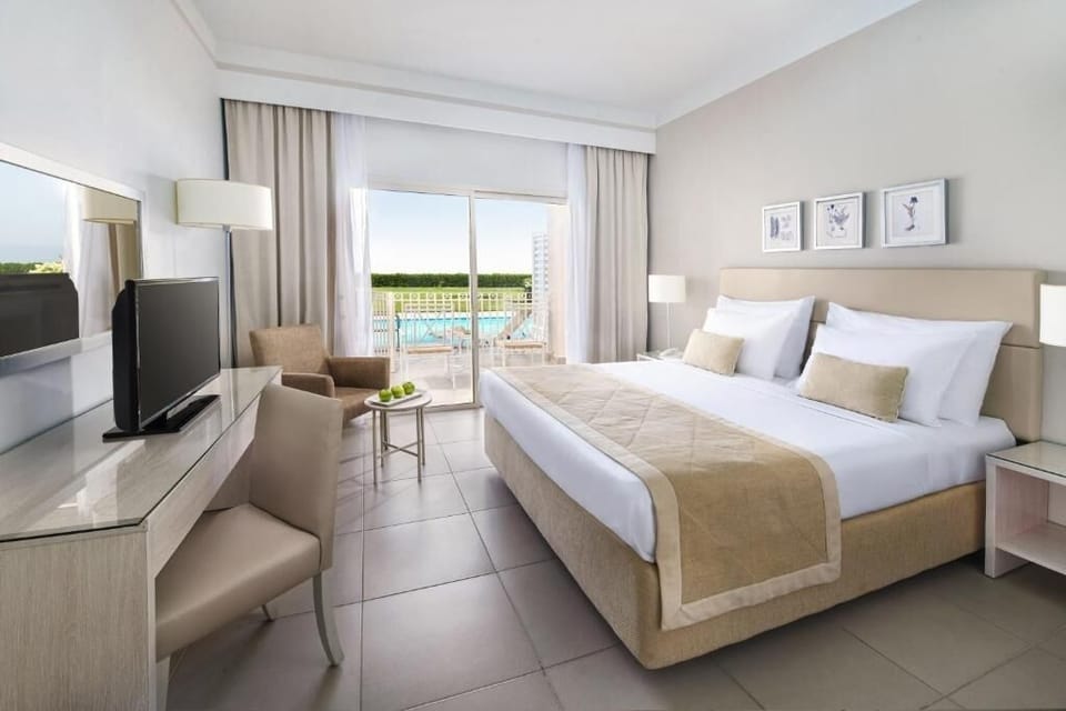 Sink into crisp linens and wake to serene resort views.