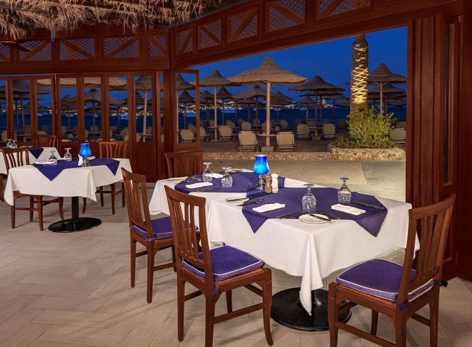 Dine seaside as the evening breeze sets a romantic mood.