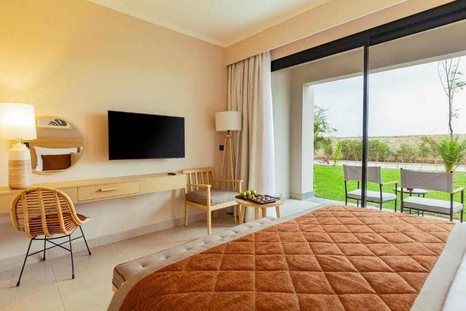 Settle in with streaming-ready TV and bright terrace doors.