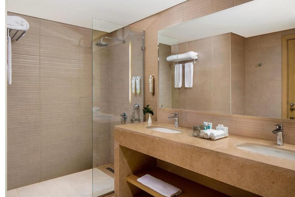 Refresh under a rainfall shower with spa-smooth finishes.