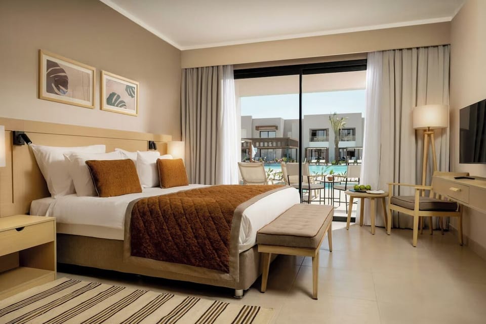 Wake up to pool views from a serene king bedroom.