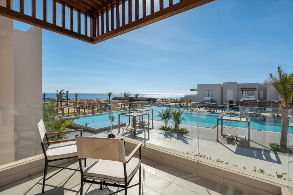 Unwind on the terrace while the pool sparkles below.