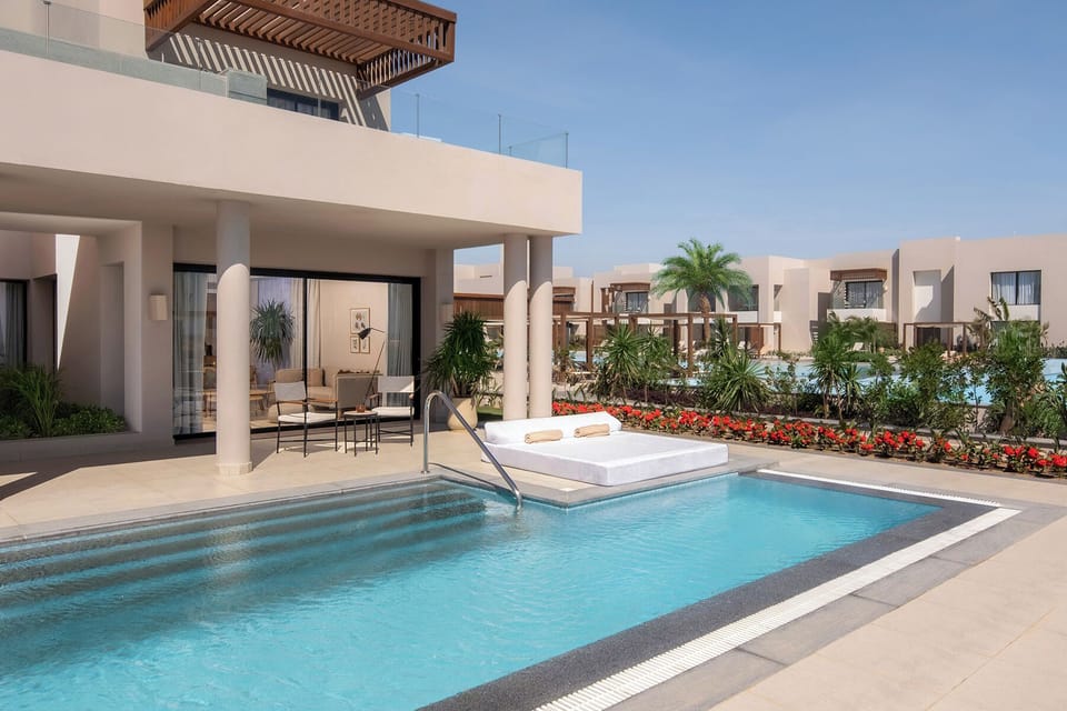 Dive into your private pool steps from the terrace.