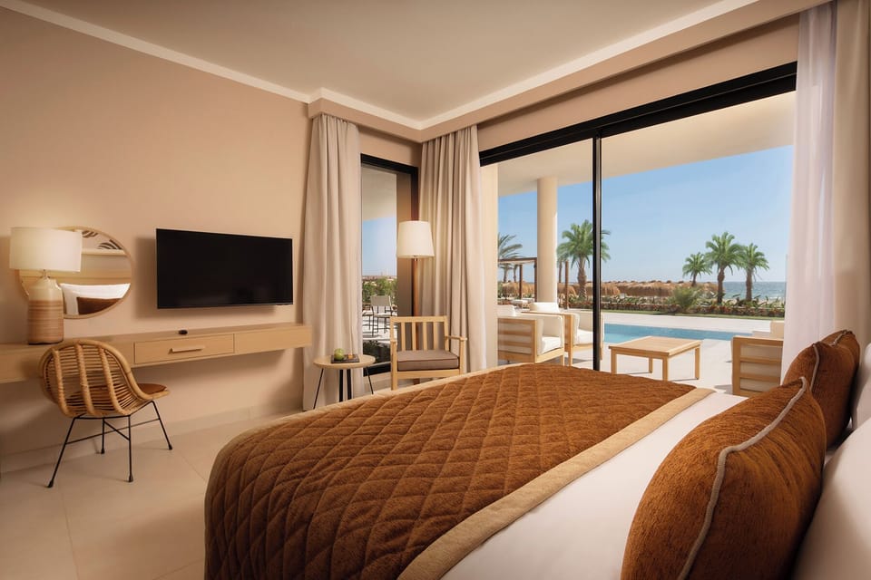 Indulge in a dreamy king bed with sweeping sea views.