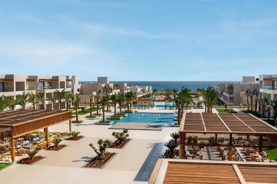 Admire the resort’s glowing waterways leading straight to sea.