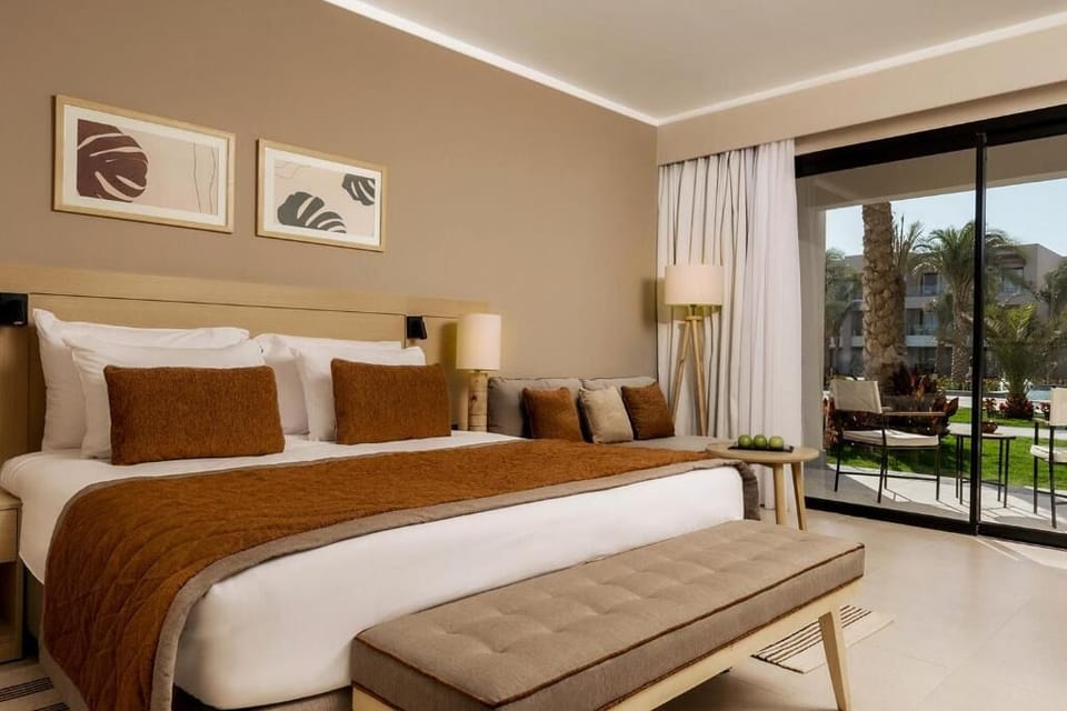 Sip morning coffee beside sliding doors and soft linens.