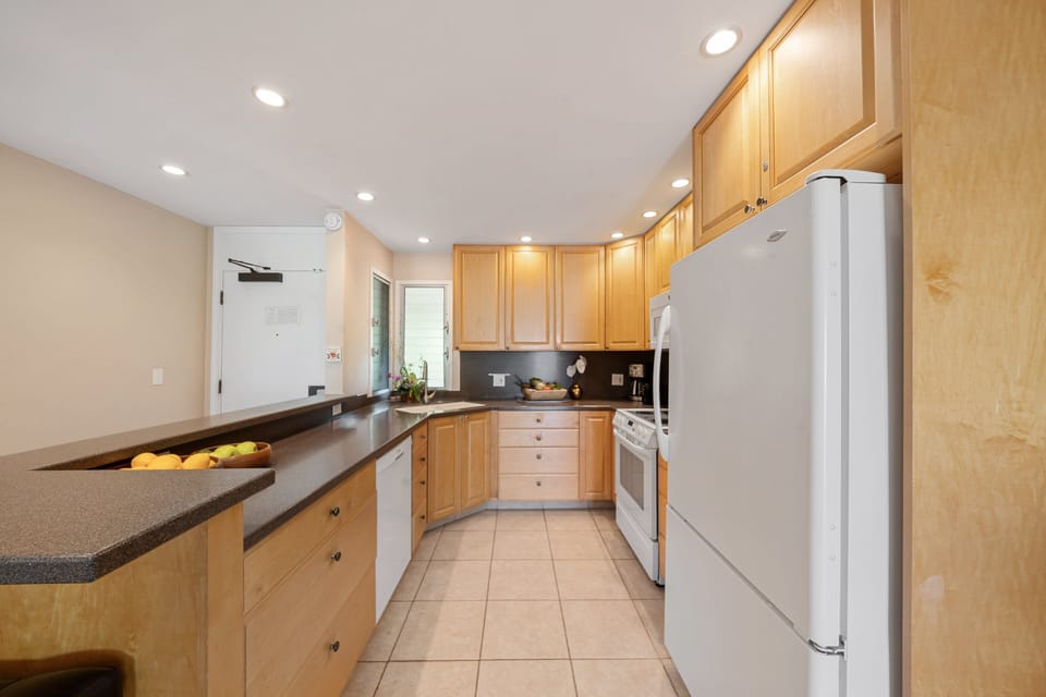 Fully equipped kitchen with white appliances for your convenience