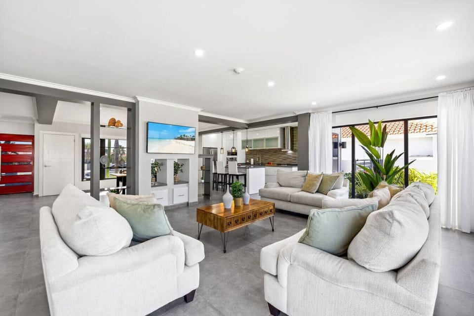 Bright, open living room with cozy seating.